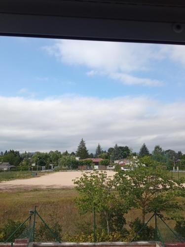 a view of a baseball field from a window at Puente Villanueva dreans in Medina de Pomar