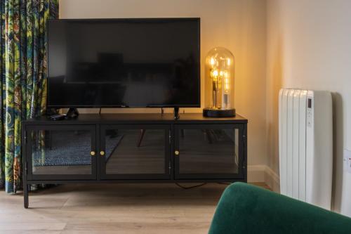Boyne View Houseにあるテレビまたはエンターテインメントセンター