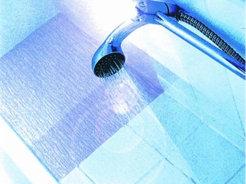 a toothbrush in a shower with a blue at Dutchman Hotel in Blackpool