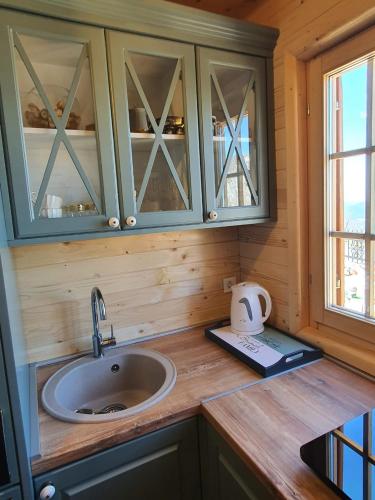 a kitchen counter with a sink and a window at Villa Skyline in Kotor