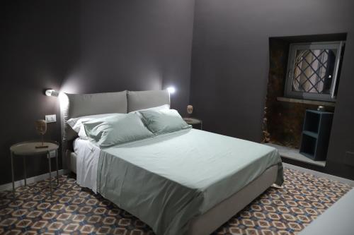 Postel nebo postele na pokoji v ubytování il sacrato di casa loreto