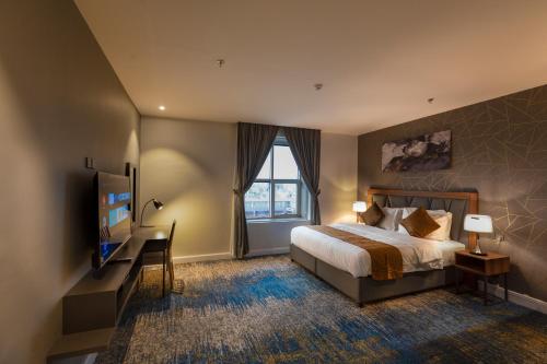 Кровать или кровати в номере دانة المروج للشقق المخدومة Danat Almourouj Serviced Apartment