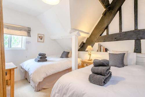 Säng eller sängar i ett rum på Fern Hall Cottage
