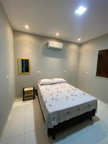 a bedroom with a bed in a room at Casa Mar é Vida in Prea