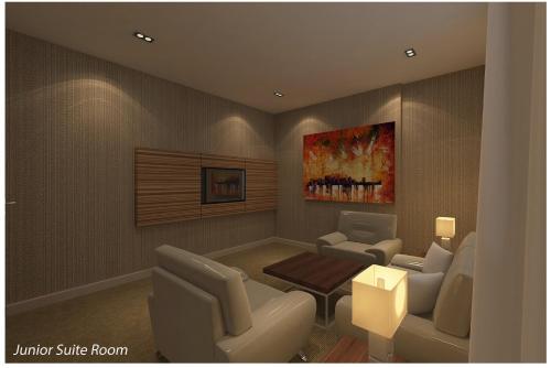 a rendering of a waiting room with chairs and a table at Hotel Excelsior Ipoh in Ipoh
