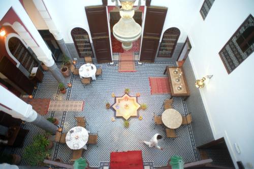 an overhead view of a room with tables and a star at Riad Tafilalet in Fès