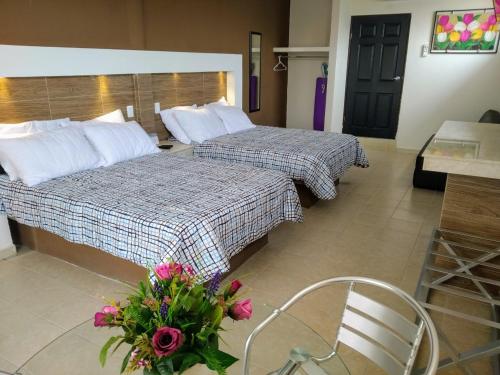 מיטה או מיטות בחדר ב-Casa Paraíso Habitaciones en el Centro de Ciudad Valles
