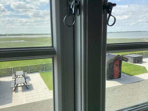 a view of the ocean from a window at 10 person holiday home in Roslev-By Traum in Roslev