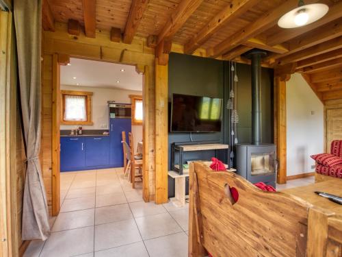 a living room with a couch and a fireplace at Chalet Morillon Village, 6 pièces, 9 personnes - FR-1-642-66 in Morillon