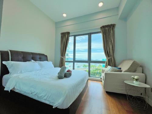 a bedroom with a bed with a teddy bear on it at Maison life 小居屋 The Loft Imago in Kota Kinabalu