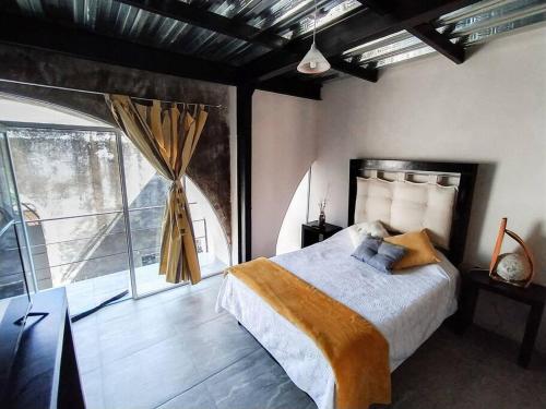 Een bed of bedden in een kamer bij Casa con alberca dentro de ex-hacienda en Atlixco