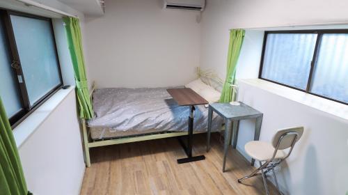 Ein Bett oder Betten in einem Zimmer der Unterkunft GLOCE 海行燈 l 江ノ島から徒歩5分 小型犬可