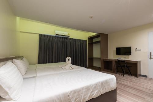 En eller flere senge i et værelse på Siam Star Hotel