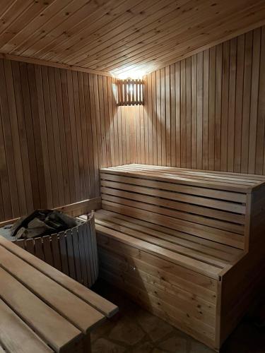 a sauna with two benches and a light in it at GLAMPING WOLF MOUNt in Margahovit