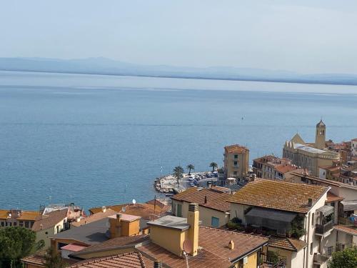 an aerial view of a city and the ocean at BILOCALE VISTA MARE CON POSTO AUTO in Porto Santo Stefano