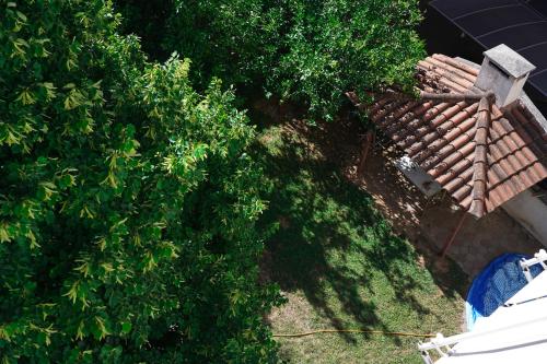 an overhead view of a roof of a house with trees at Oreon Suites - 'Ophelia' in Nafplio