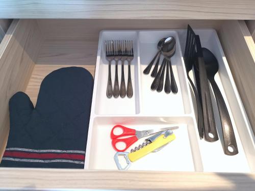 a plastic drawer with utensils in a kitchen at C24 Seven Seas Cote DAzur Luxury Private in Na Jomtien