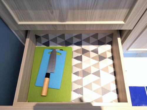 a knife on a cutting board in a drawer at C24 Seven Seas Cote DAzur Luxury Private in Na Jomtien