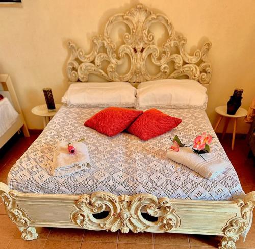 an ornate bed with two pillows on it at Trullo Antelmi in Ceglie Messapica