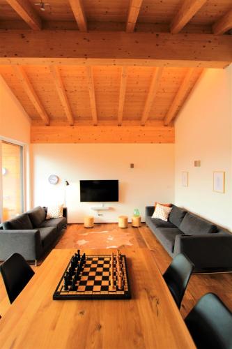 a living room with a chess board on the floor at Mountain Penthouse Top 8 & 9 in Fügen