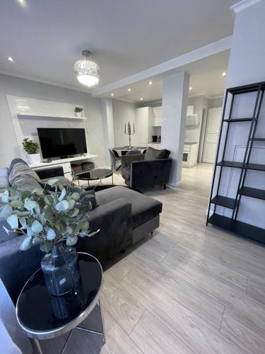 a large living room with a couch and a table at Brother street apartment in Liepāja