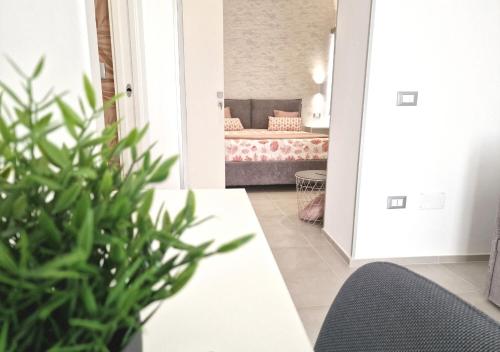 a living room with a bed in a bedroom at B&B Tra le vie del borgo in Vieste
