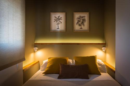 a bedroom with a bed with two palm trees on it at K-TERRA by Nuka Homes in Jávea