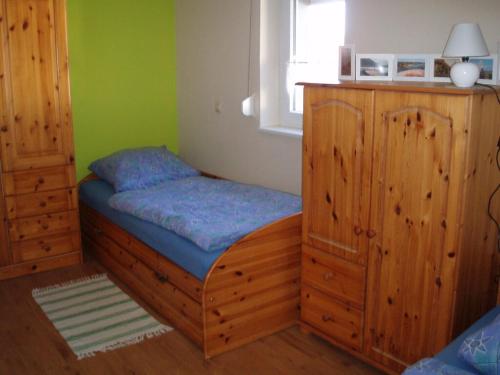 a small bedroom with a bed and a window at Ferienhaus Silvia in Rödelmaier