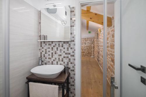 a bathroom with a toilet and a sink at Villa Ivea in Višnjan