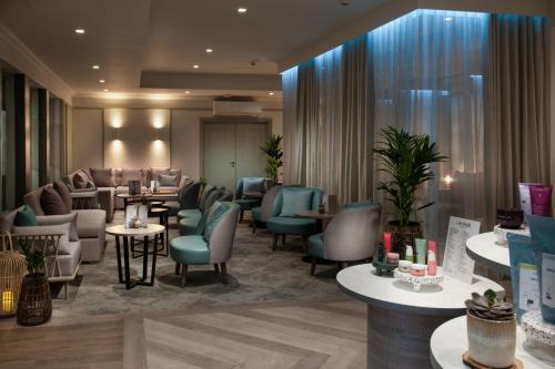 a salon with chairs and tables and a waiting room at Aztec Hotel and Spa in Bristol