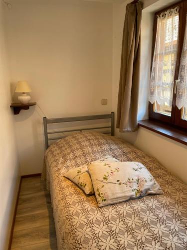 Ένα ή περισσότερα κρεβάτια σε δωμάτιο στο Gîte Le Hissala