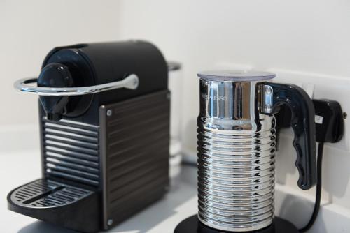 a black blender sitting on top of a counter at Luxury cottage in Stamford featured in the Sunday Times, best place to live in Stamford