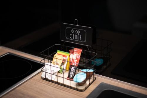 a shelf with a sign that reads good stuff at Luxury Apartments Una Sarajevo in Sarajevo