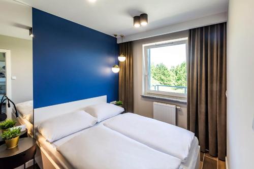 Ένα ή περισσότερα κρεβάτια σε δωμάτιο στο VacationClub – Porta Mare Baltica Apartament 8A