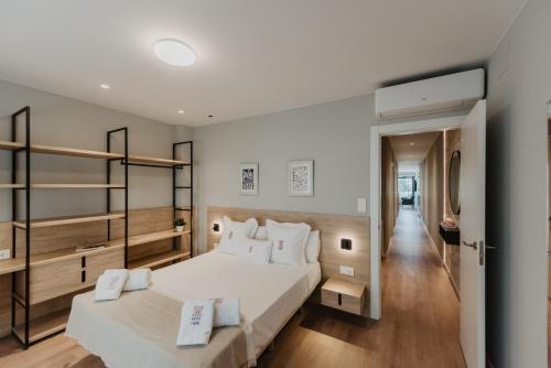 Posteľ alebo postele v izbe v ubytovaní Petit Luxe Volta Apartaments