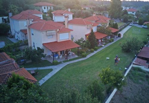 an aerial view of a house with red roofs at Cookoo Villas in Kriopigi