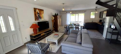 a living room with a couch and a table at La Maison d'Alphonse in Avignon