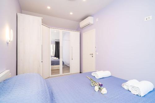 Postel nebo postele na pokoji v ubytování Andelic Sunset Apartments