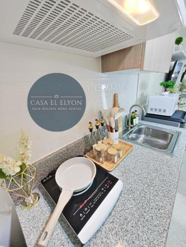 a kitchen with a counter with a kitchen appliance on it at White Nordic Fully-Furnished Studio at INSPIRIA in Davao City