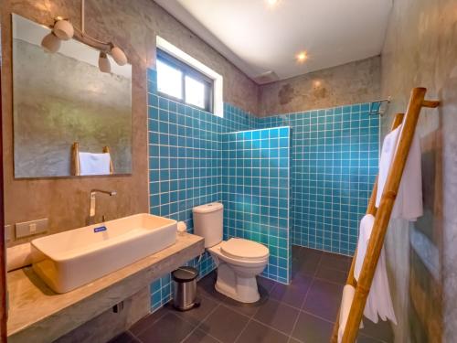 a bathroom with a sink toilet and a mirror at Villa AUREA Sea View in Koh Samui