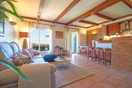 a living room with a couch and a table at Casa Benagil Mar by Algarve Holidays in Lagoa