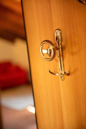 a close up of a door with a door knob at Hotel Diffuso Locanda Elisa in Dimaro