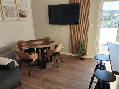 TV a/nebo společenská místnost v ubytování Apartament Piaskowa Duna
