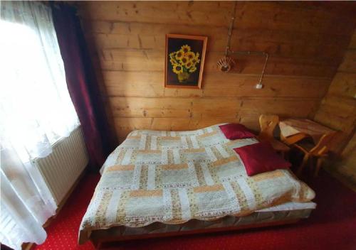 Cama o camas de una habitación en Dom Pracy Twórczej i Wypoczynku Wojtuś