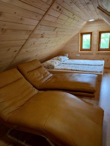a room with two beds in a attic at Romantic Mountain Chalet and SPA Tubej in Bohinj
