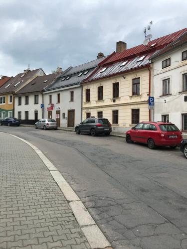 a group of cars parked on the side of a street at FiftyShades Apartmán s vířivkou in Jihlava