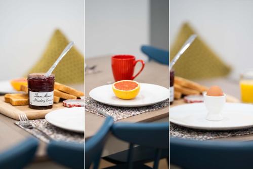 a table with plates of food and a cup of coffee at Harbour Moorings in St Ives