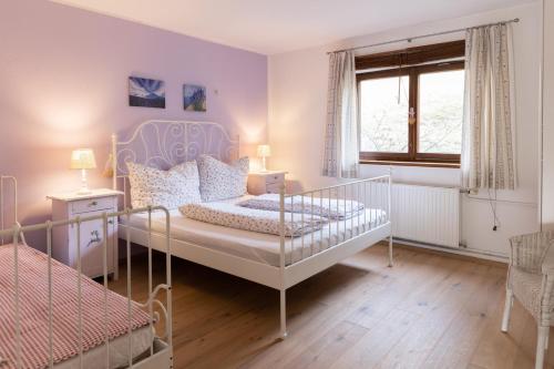 a bedroom with a bed and a window at Bühlhäusl in Grünau im Almtal