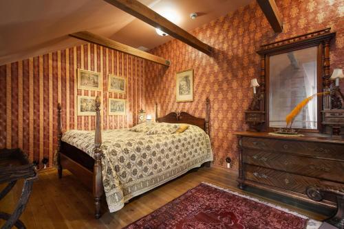 Un pat sau paturi într-o cameră la Börsen Apartment Suites