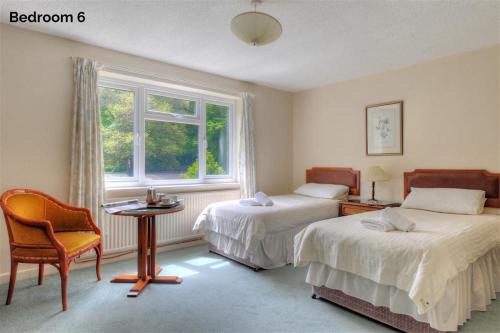 A bed or beds in a room at The Orchard Country House